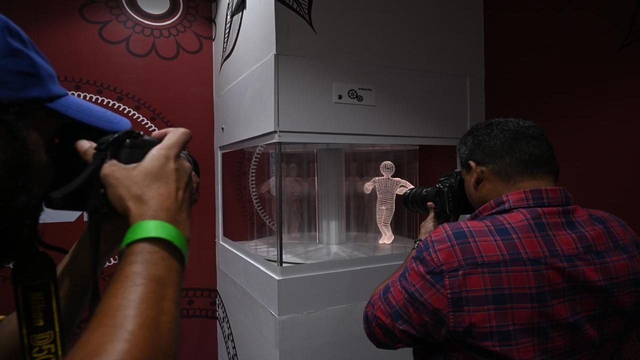 Photographers capture the exhibits in their cameras at the museum on Thursday