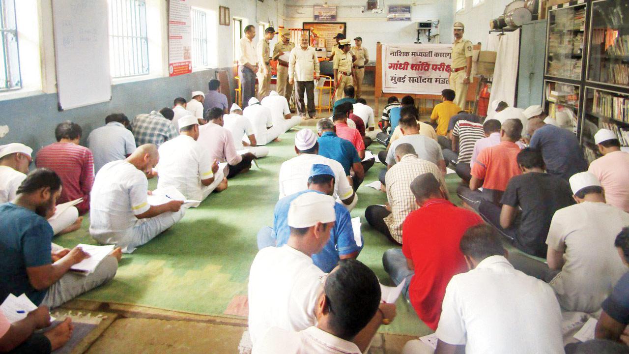 The inmates of the Nashik jail take a test on Mahatama Gandhi