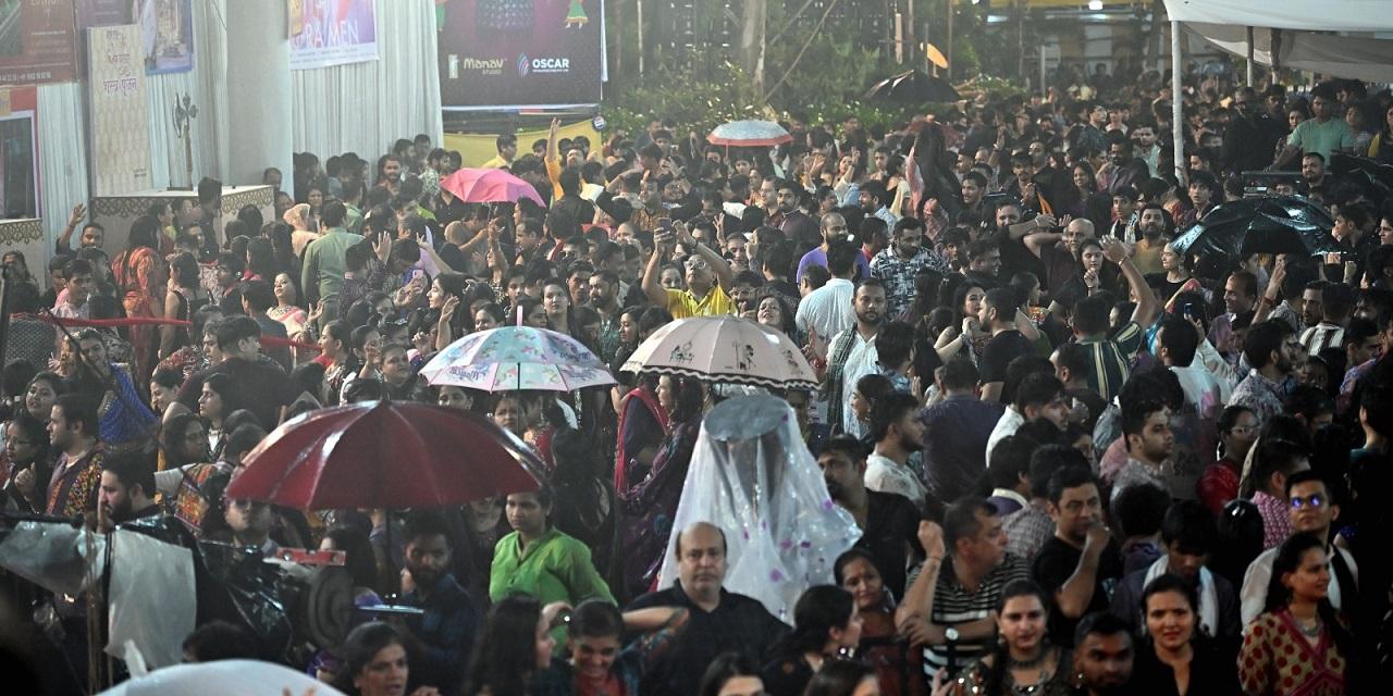 Despite the unexpected weather, the spirit of the festival remained undampened as people continued to celebrate with vibrant energy, honouring the traditional dance that marks this joyous occasion