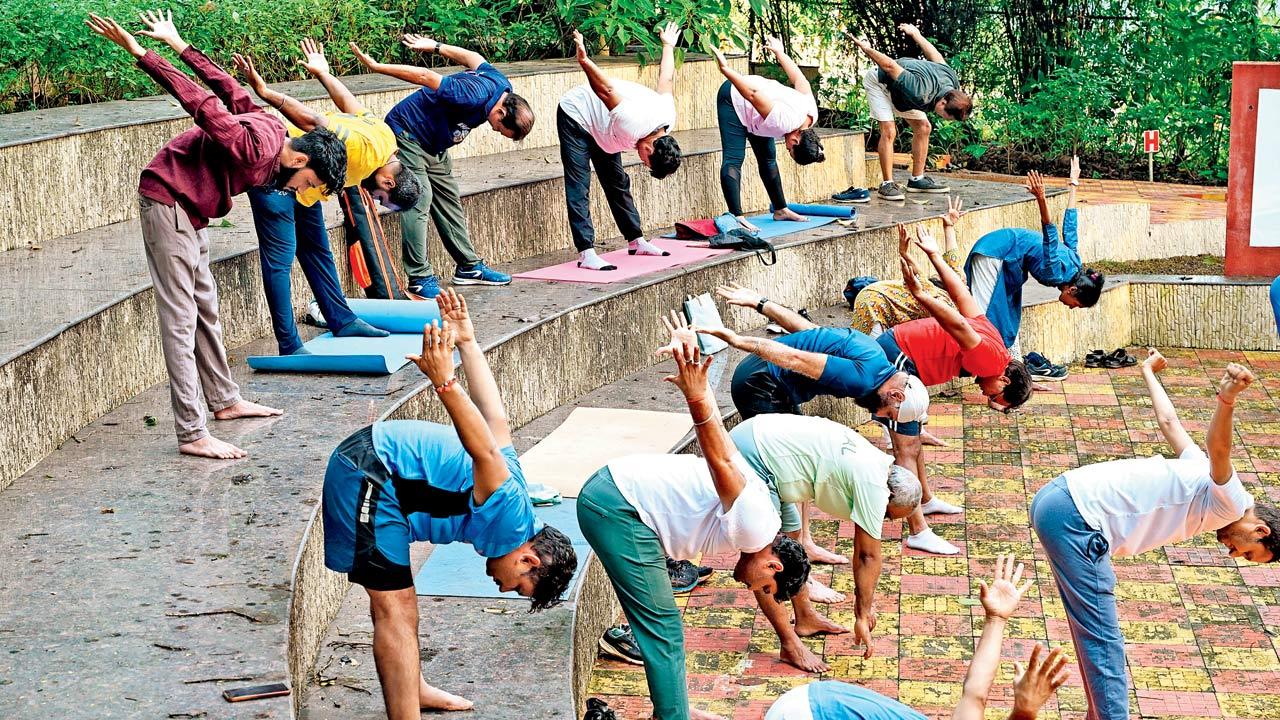 Participants learn the standing chakrasana at the amphitheatre 
