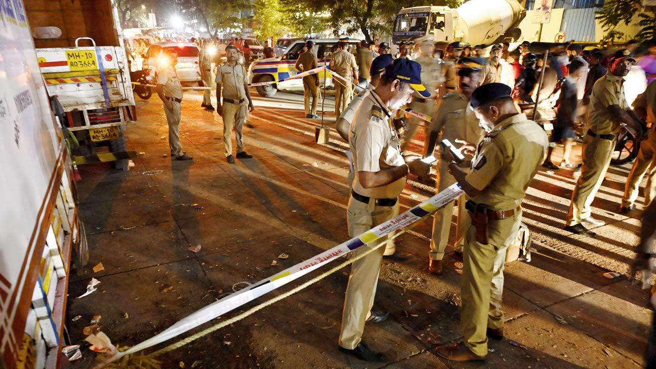 Police officers at the site of the shooting