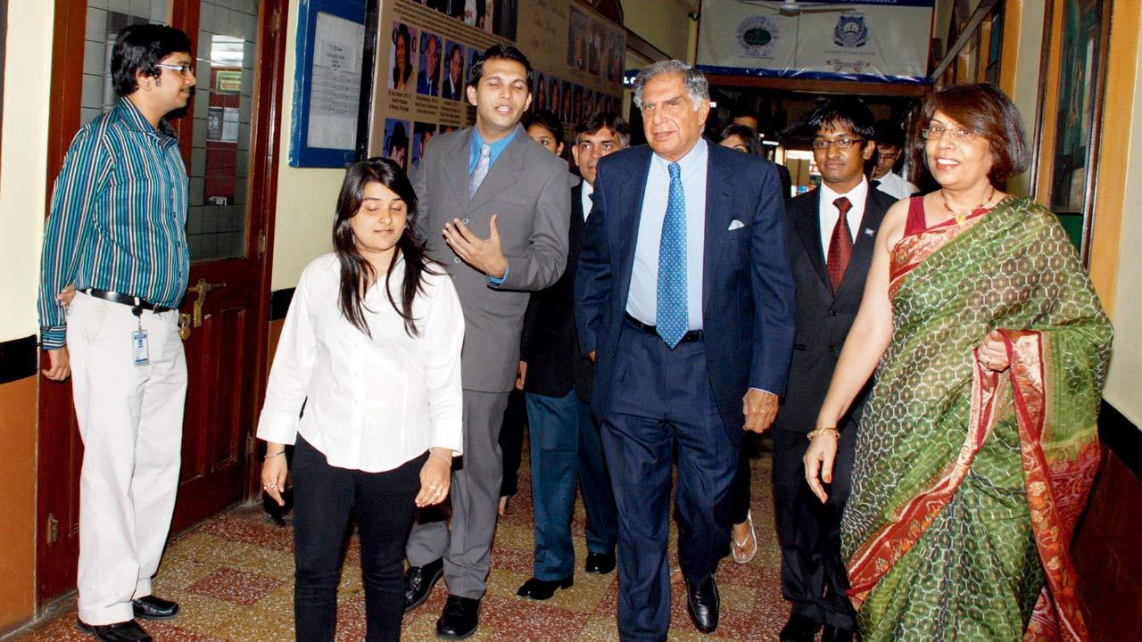 Founder of Xtremely Young Zoroastrians Hoshaang Gotla (in grey suit) with Ratan Tata