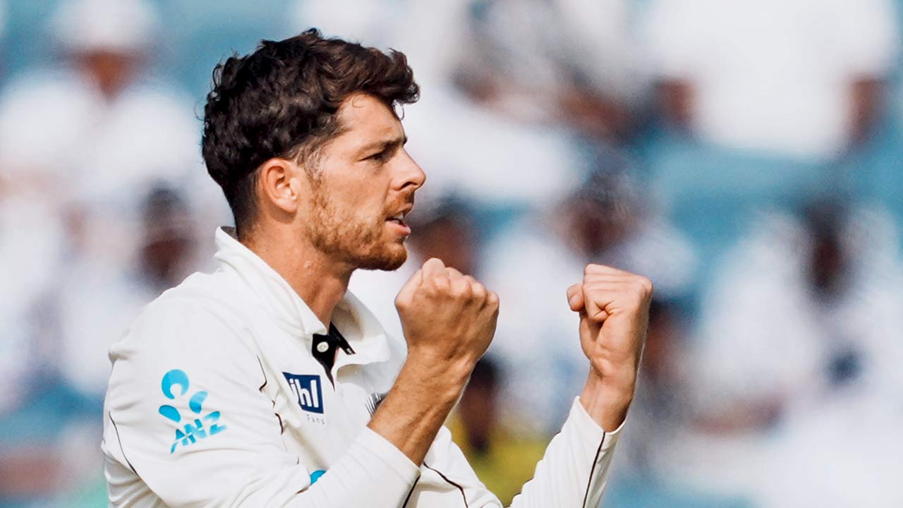 NZ’s Mitchell Santner celebrates the wicket of India’s Ravichandran Ashwin in Pune on Saturday