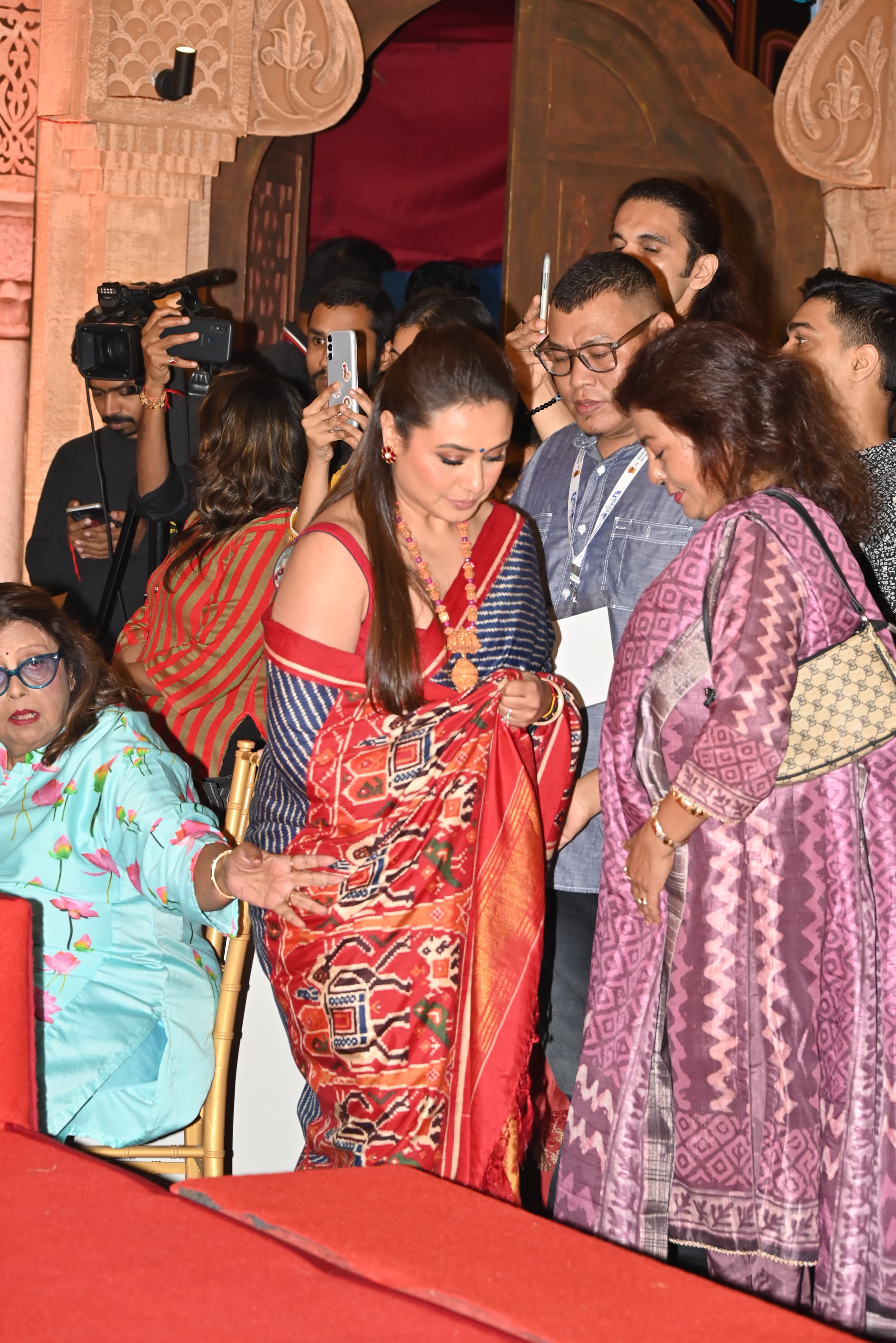 During their visit today, Rani was seen in a black saree with a red border