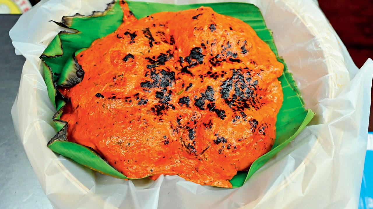 Tandoori momos in bright orange gravy