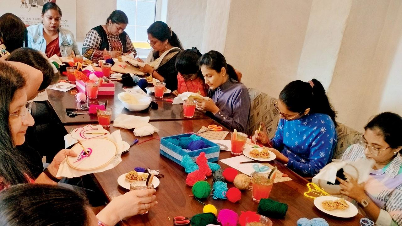 Participants work on their pieces at a previous workshop 