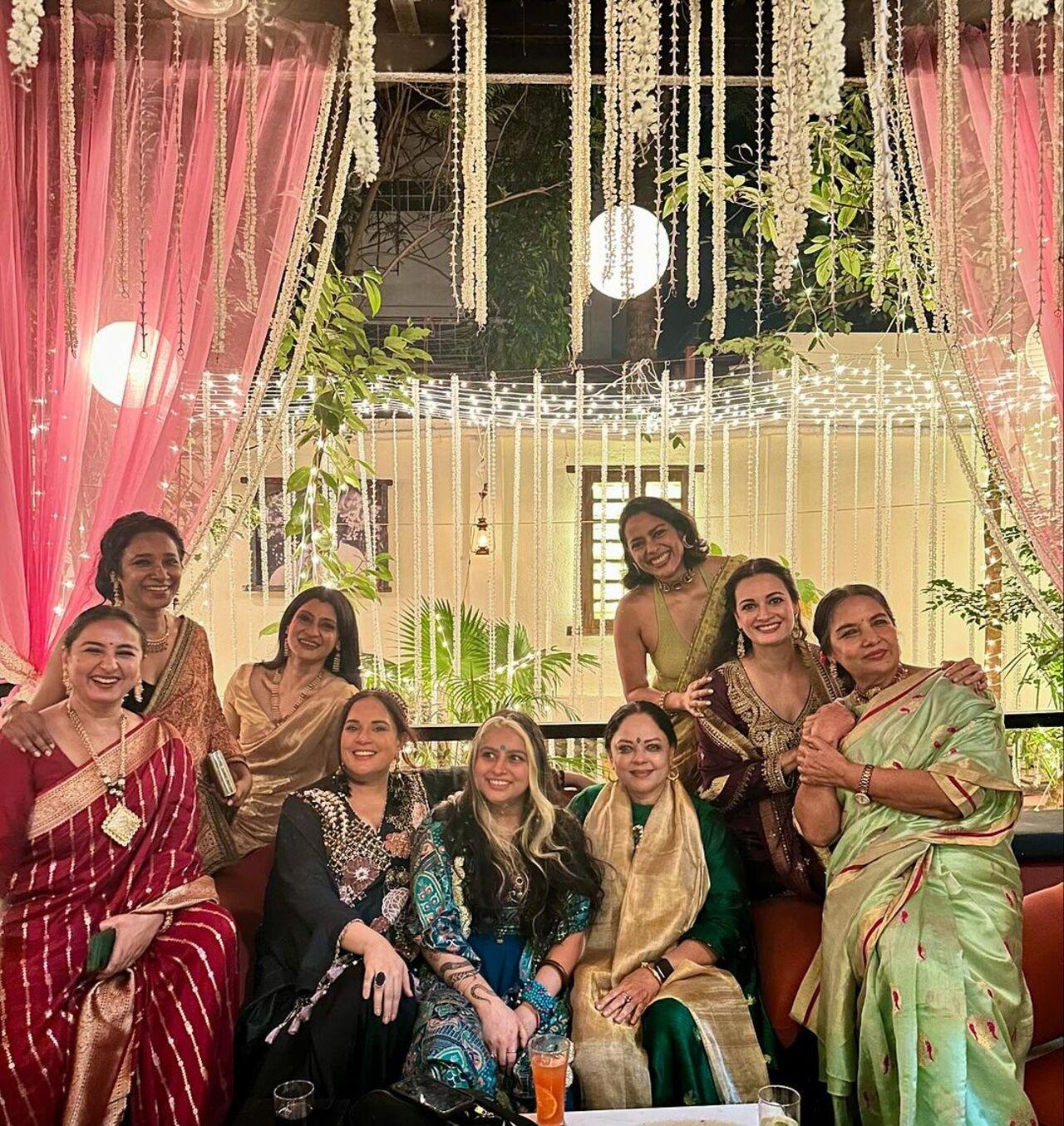 The ladies strike a pose together at the party