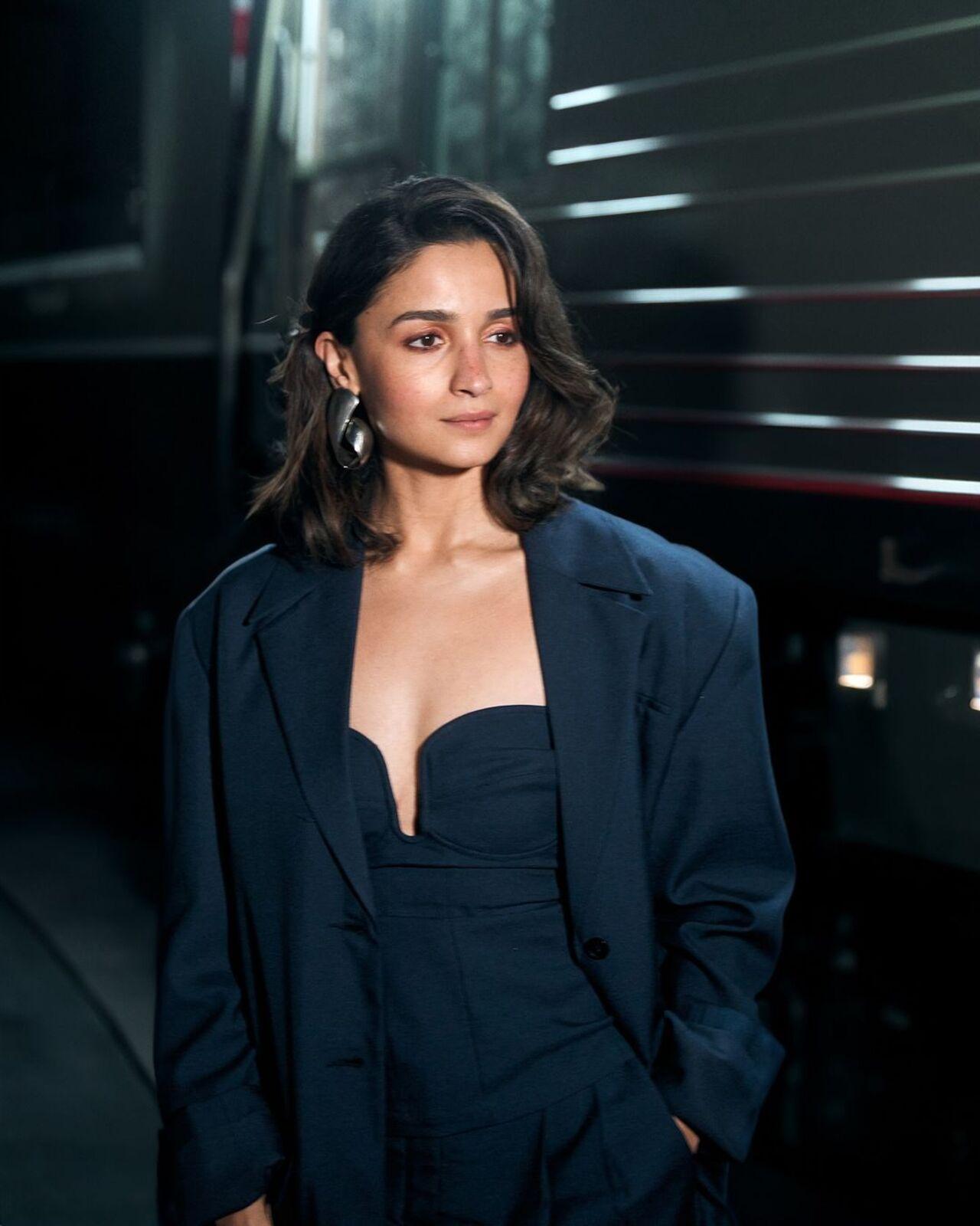 She went for a strapless jumpsuit layered with a blazer that commenced her fashion streak for the film.