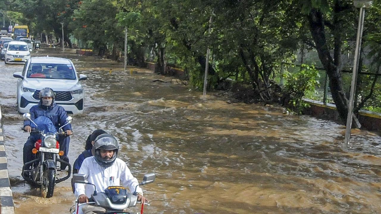 People waded through the flooded roads to reach their destination