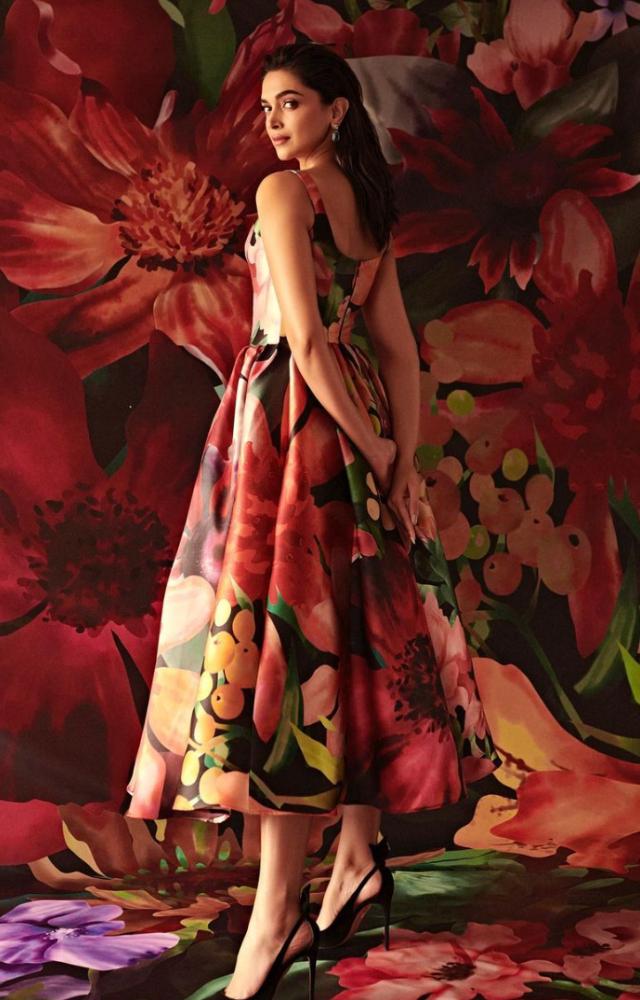 Deepika Padukone looks exquisite in the red and black floral ensemble. The dual contrast of colours makes it perfect for parties and sophisticated events. 