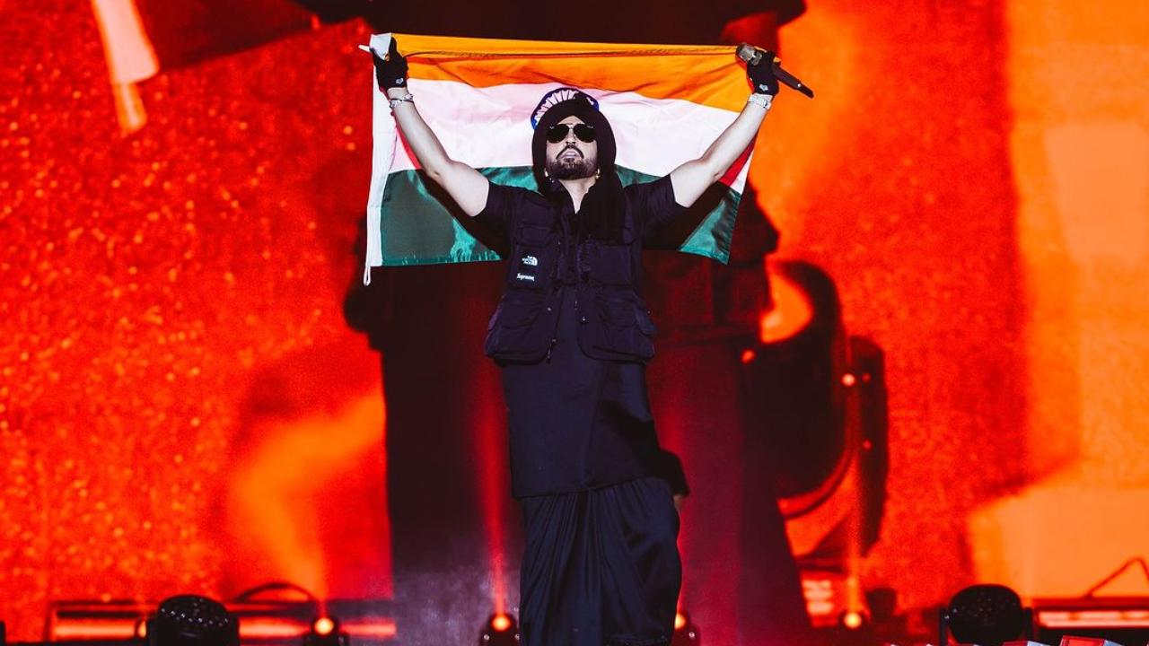 Diljit Dosanjh set the stage on fire in Delhi during his Dil-Luminati India Tour 2024. The first picture shows him holding the National Flag as he stood on stage.