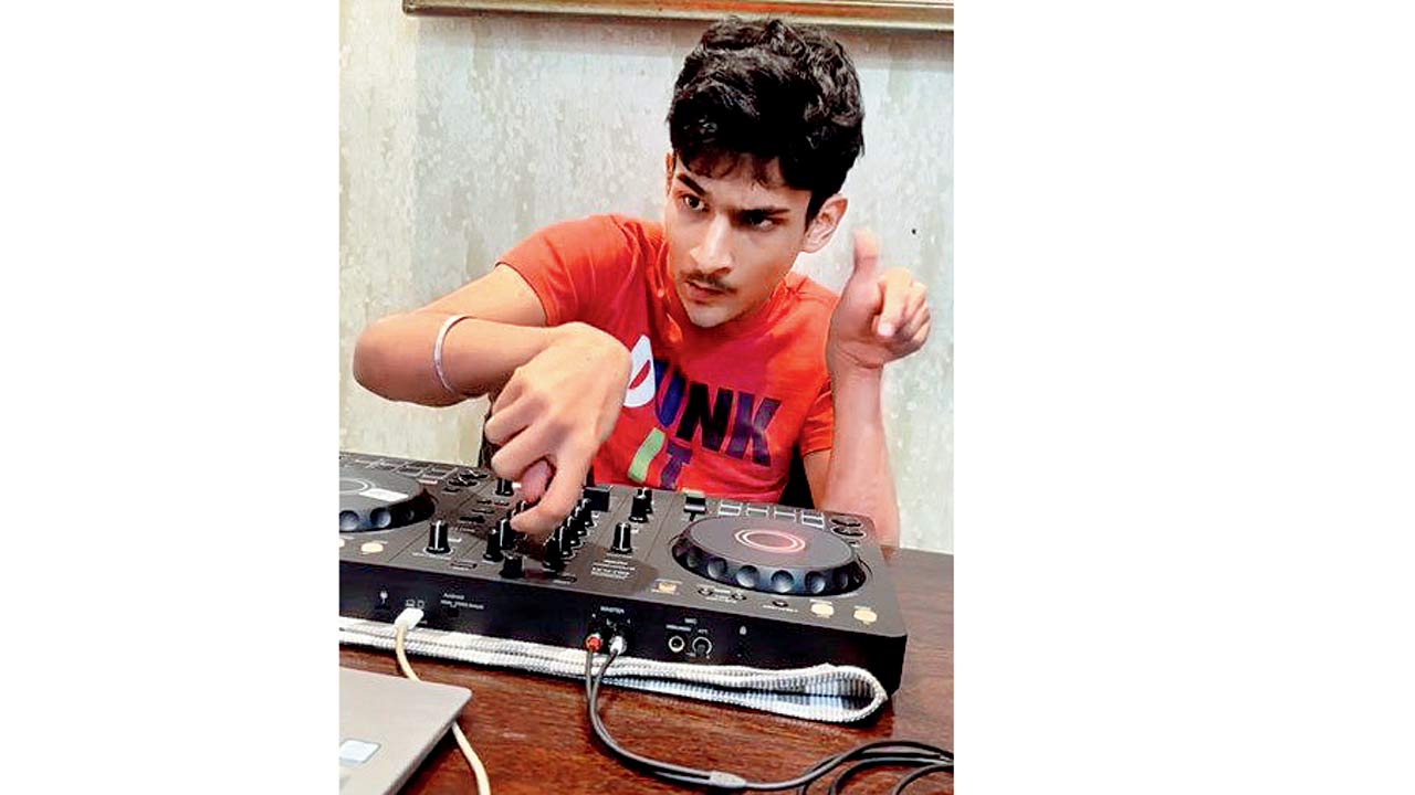 Khush Harlalka operates a DJ console 