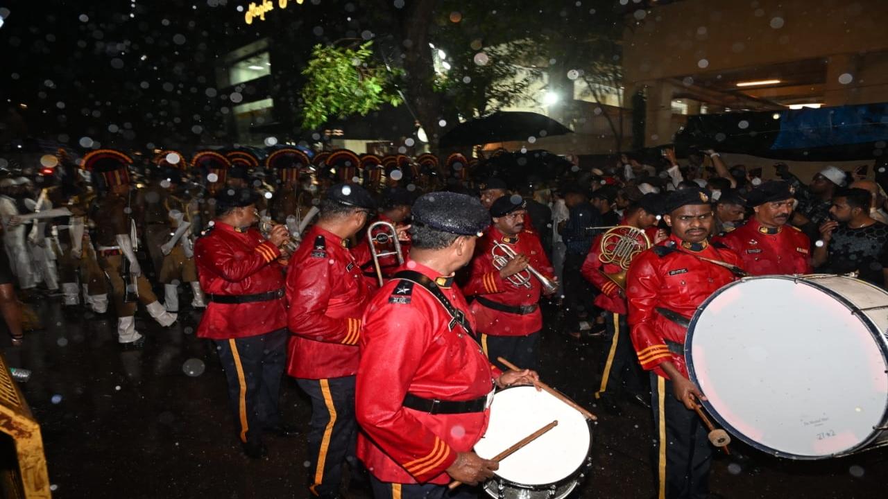 The band marches ahead of the funeral procession