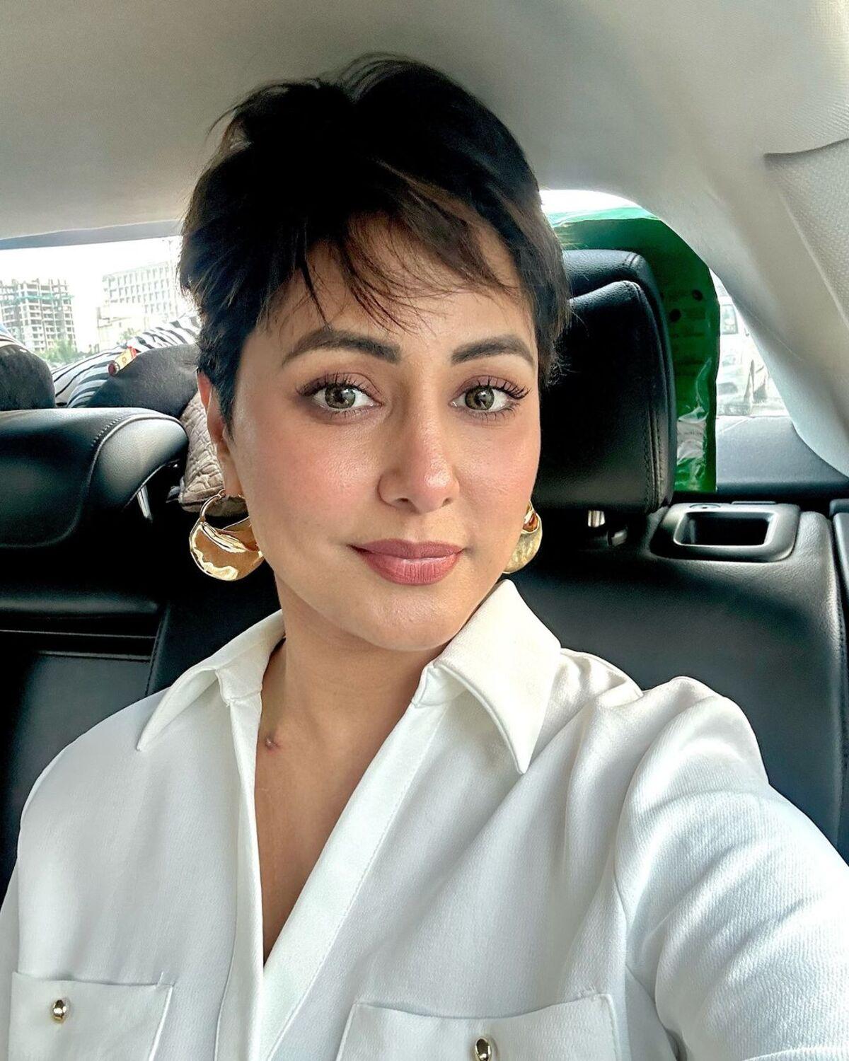 This photo is from Hina Khan's first work assignment post cancer diagnosis, she also showed her stitch marks in this look. She donned a stylish pixie hairstyle.  