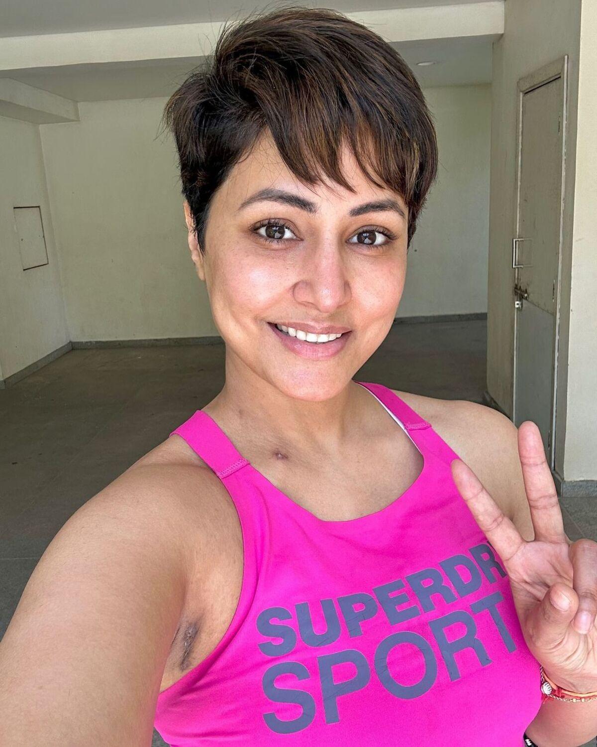Hina radiates optimism and hope with a positive affirmation about her health. This is also the first photo after she chopped her hair into a cool pixie hairstyle. 
