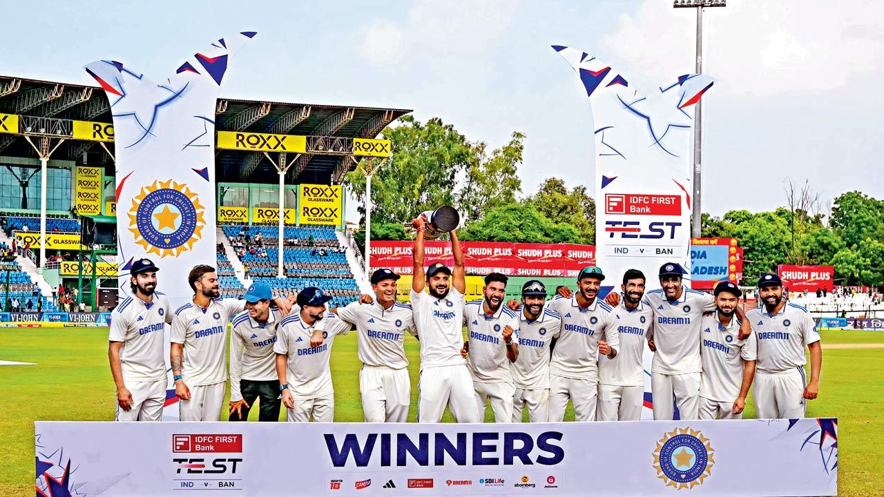 Rohit Sharma & Co celebrates India’s 2-0 Test series victory over Bangladesh at Kanpur yesterday. Pic/AFP