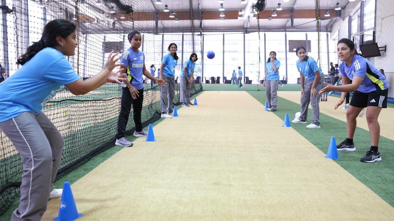 The India Women’s team, represented by Shreyanka Patil, Radha Yadav, Yastika Bhatia, Tanuja Kanwar, Uma Chetry, and Sajeevan Sajana, led an energetic session with a group of enthusiastic children