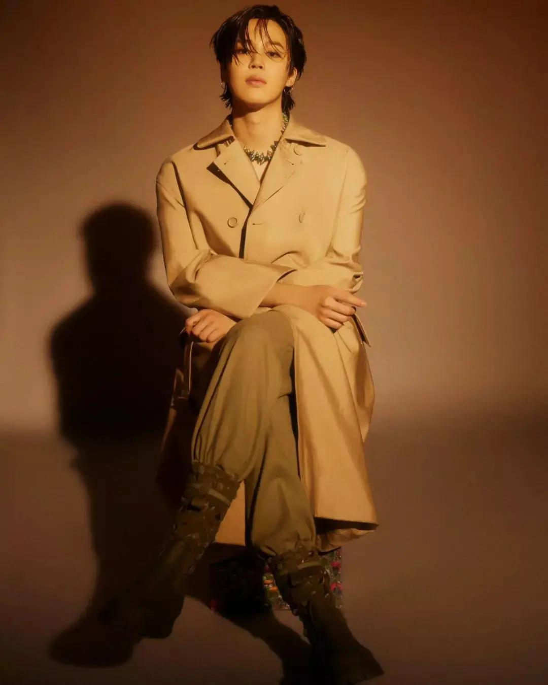 In another striking look, Jimin sported a brown ensemble with a beige-brown overcoat. The earthy tones gave him a warm aura