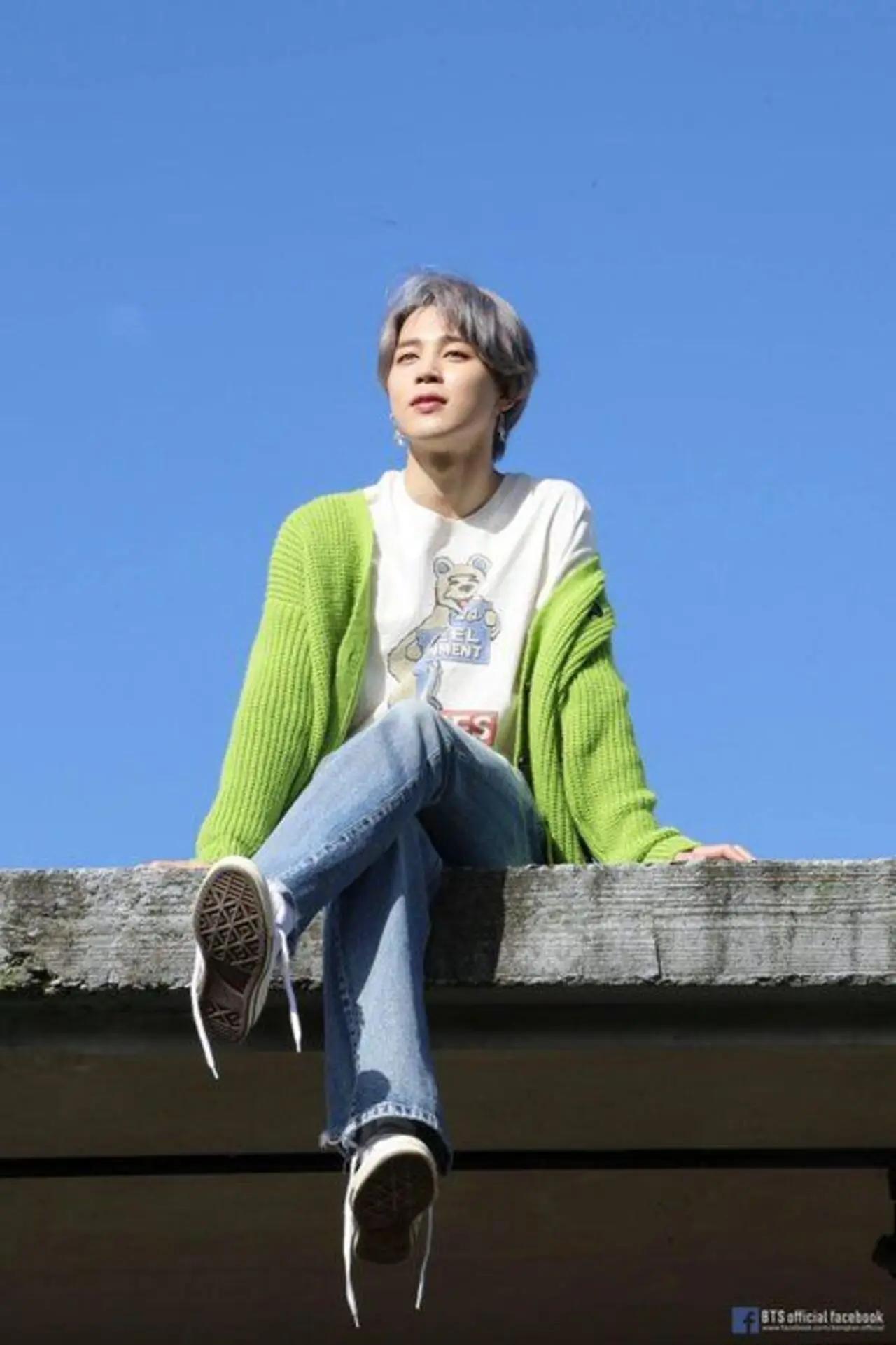 
Unlike the other BTS members who have a more distinct fashion aesthetic that is easier to delineate, Jimin likes to keep ARMY guessing. From casuals to summerwear to formals - BTS's talented lead singer can pull off any outfit. He looked stunning in this simple outfit of jeans and white-shirt layered with a forest green cardigan for the 'Life Goes On' music video shoot
