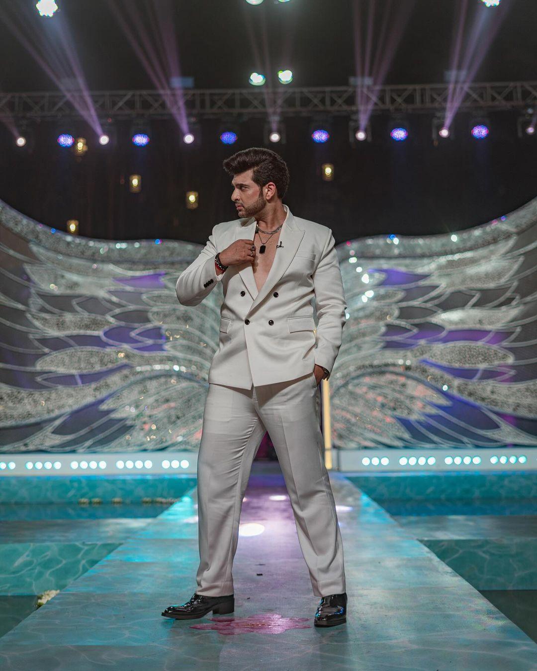 Karan Kundrra made a bold style statement in a double-breasted white suit, skipping the undershirt for a sleek, modern look.