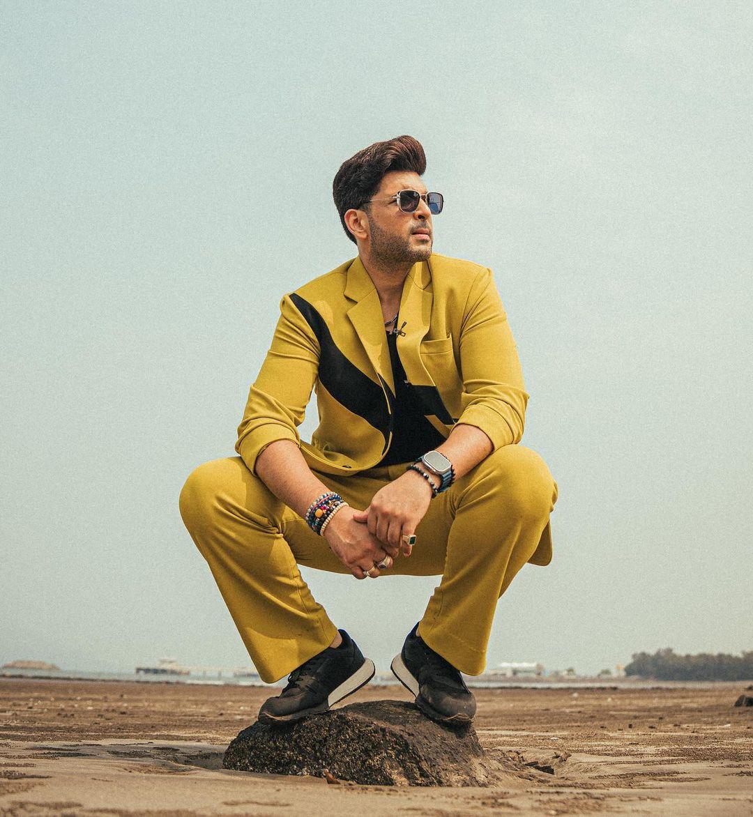 Karan Kundrra turned heads in a mustard yellow suit, pairing it with a sharp black vest underneath.