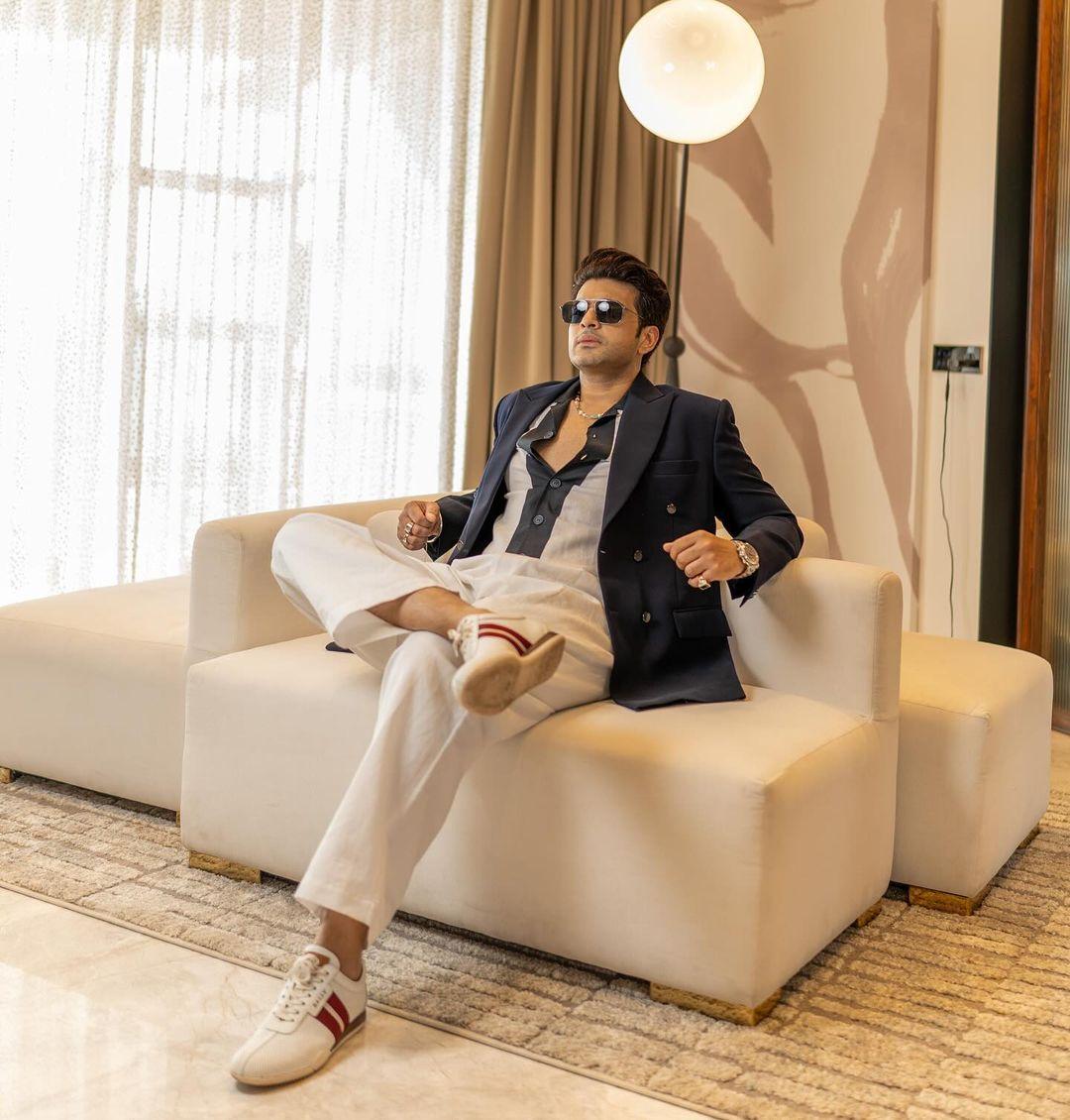 Karan Kundrra showcased a relaxed yet stylish vibe in a casual suit featuring crisp white trousers.
