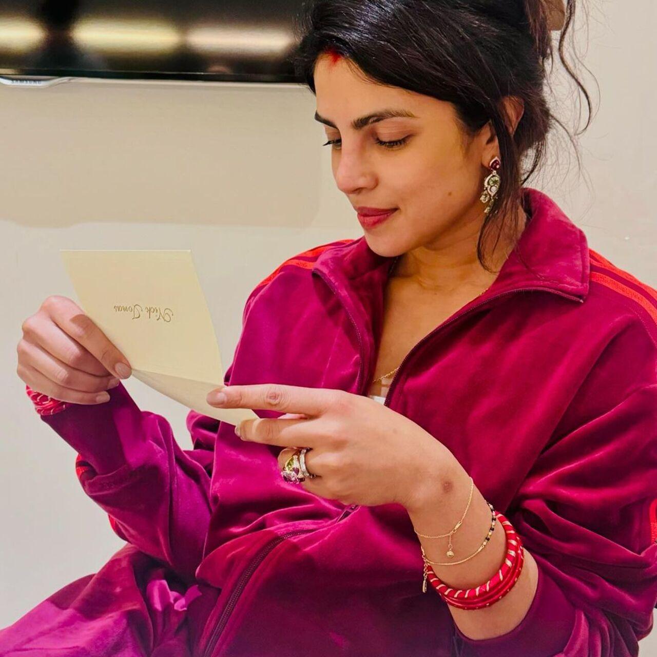 Priyanka opted for a minimalist mehendi, woe sindoor and red leisure wear on the occasion