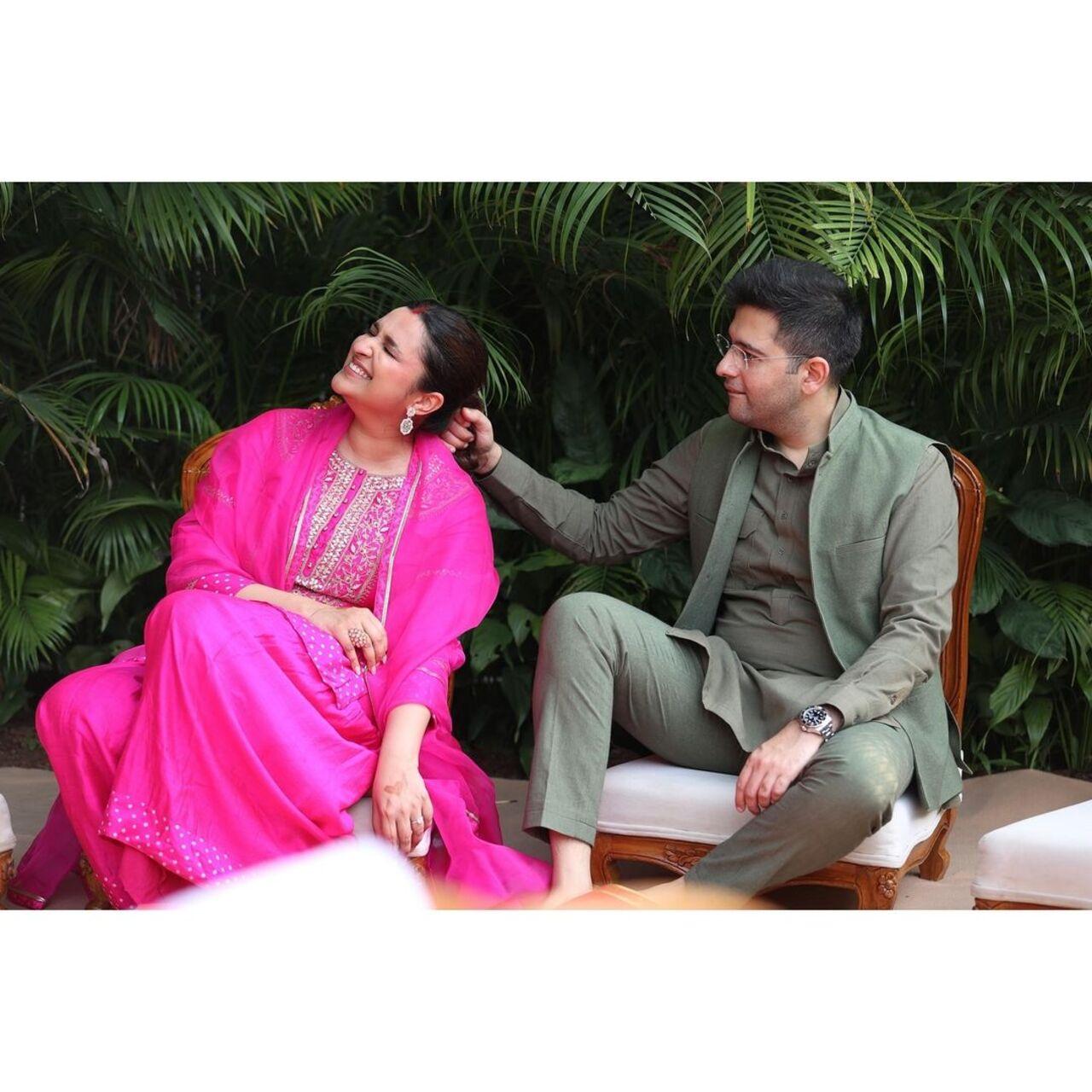 Raghav playfully pulls Parineeti's hair while they pose for pictures during the festival