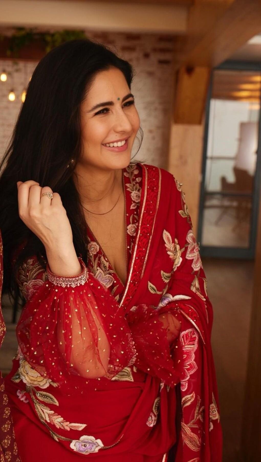 She chose a simple green bindi and a ruby studded statement ring. Katrina kept her long hair open.  