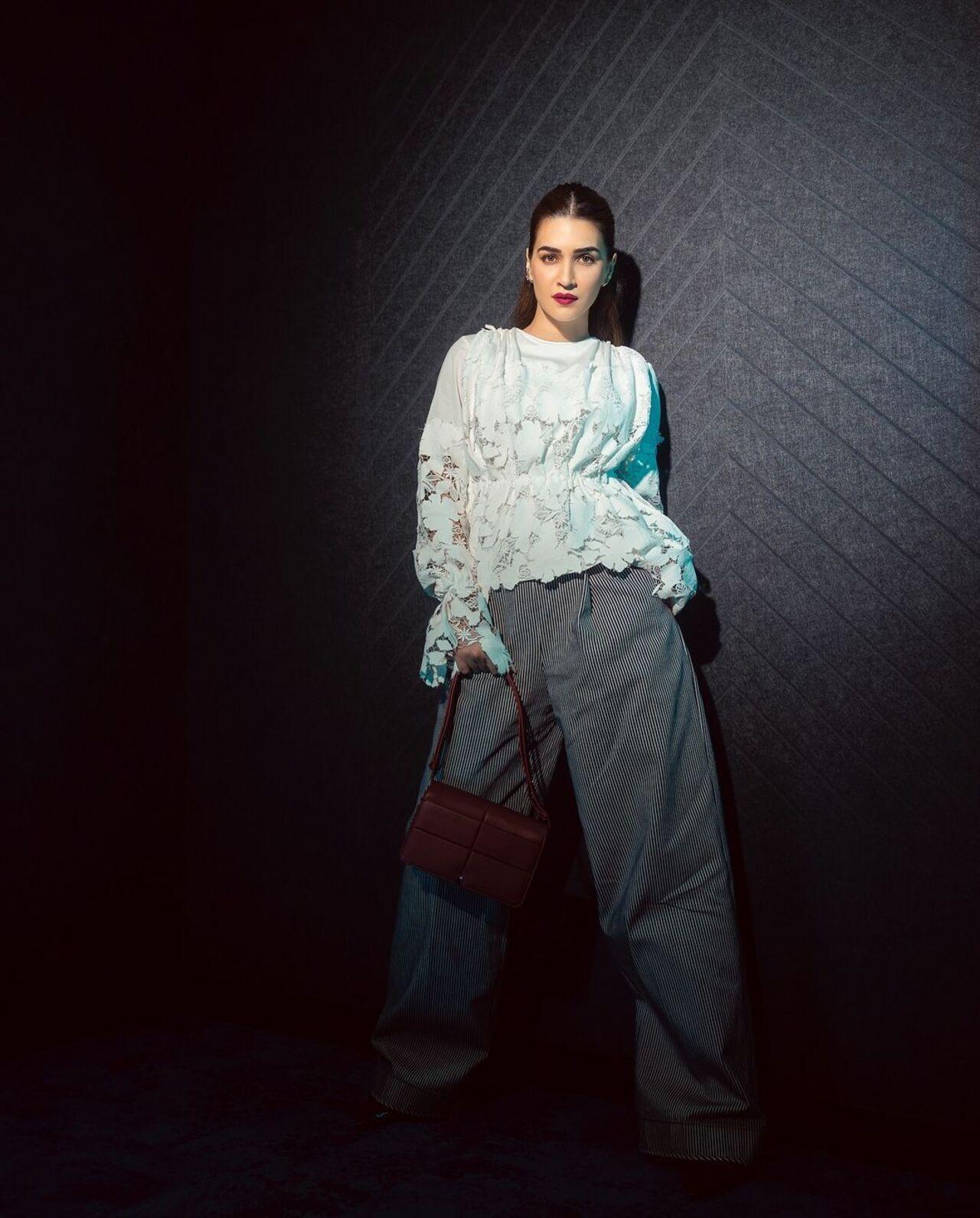 She looked chic in this white lace top and grey trousers paired by designer Bibhu Mohapatra.