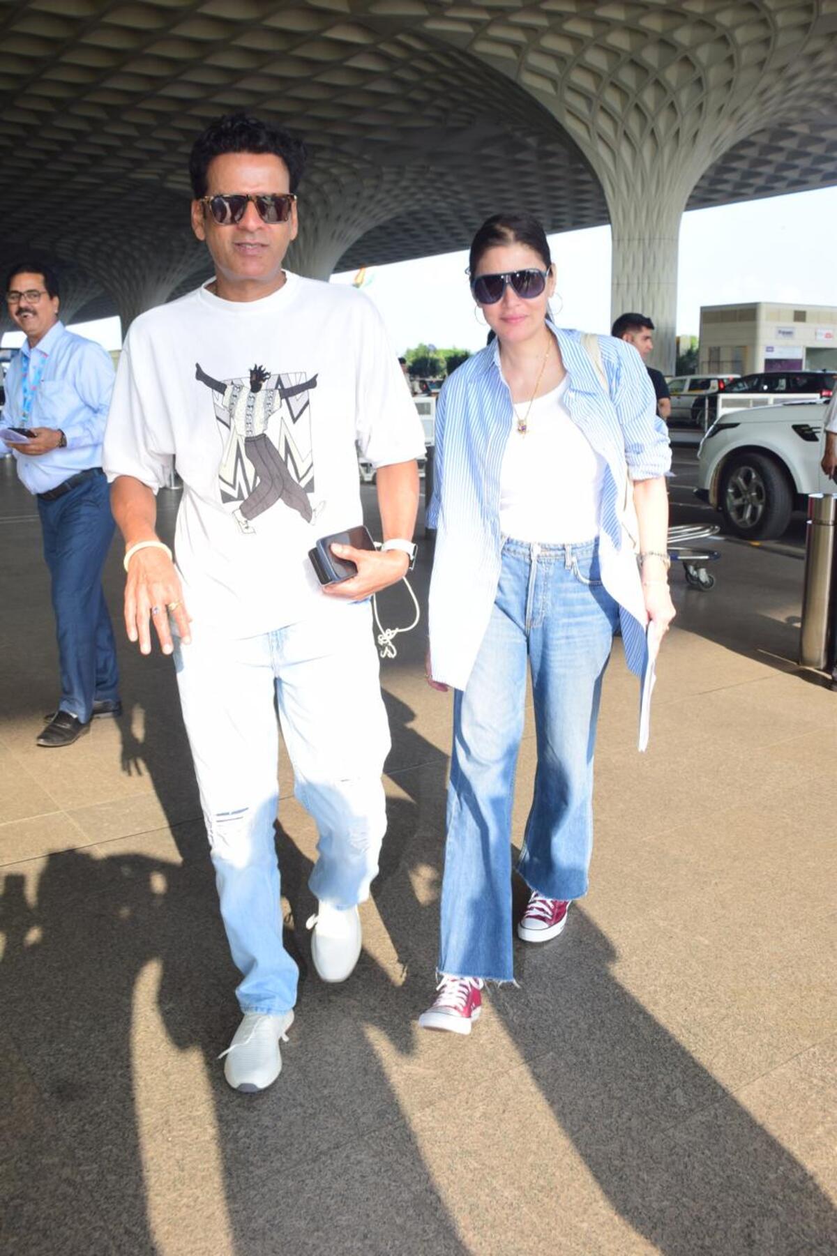 Manoj Bajpayee snapped with his wife at the airport. 