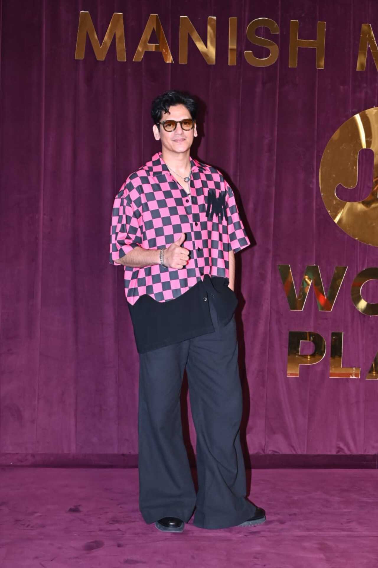 Vijay Varma stood out in a hot pink printed shirt with baggy trousers. 