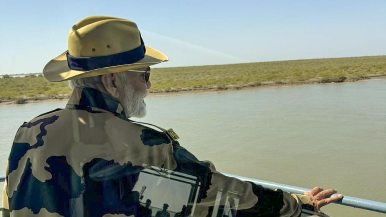 In a video shared by officials, PM Modi, wearing a BSF uniform, can be seen offering sweets to the personnel on board a patrol vessel