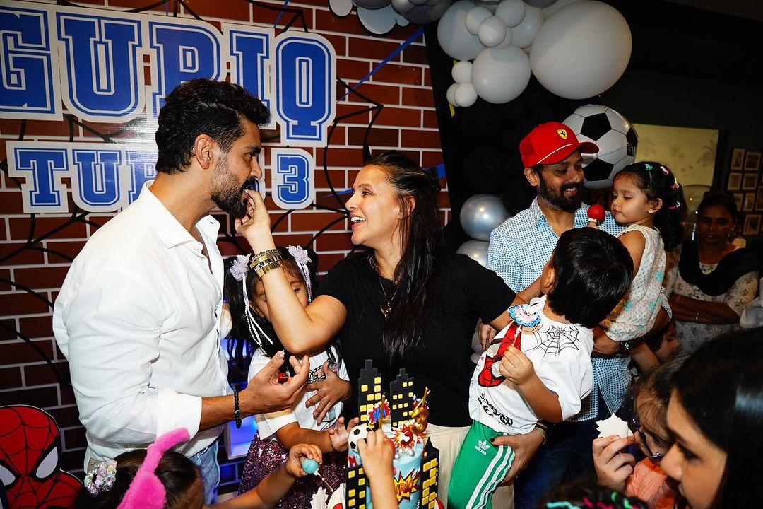 The photo album starts with Neha feeding cake to Angad while holding their son Guriq.
