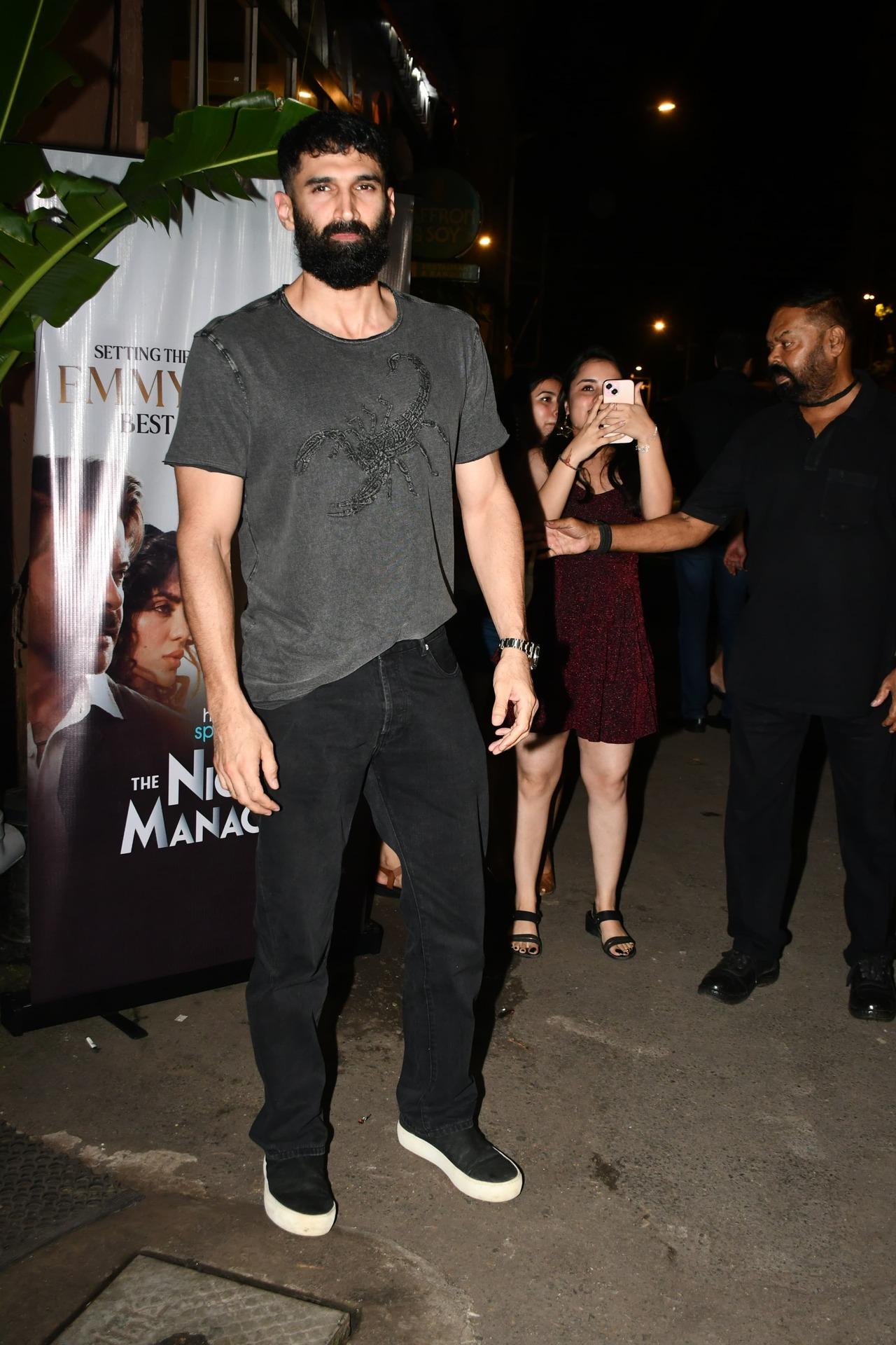 Aditya Roy Kapur kept it casual in a simple grey t-shirt and black jeans for the dinner date with the team of The Night Manager