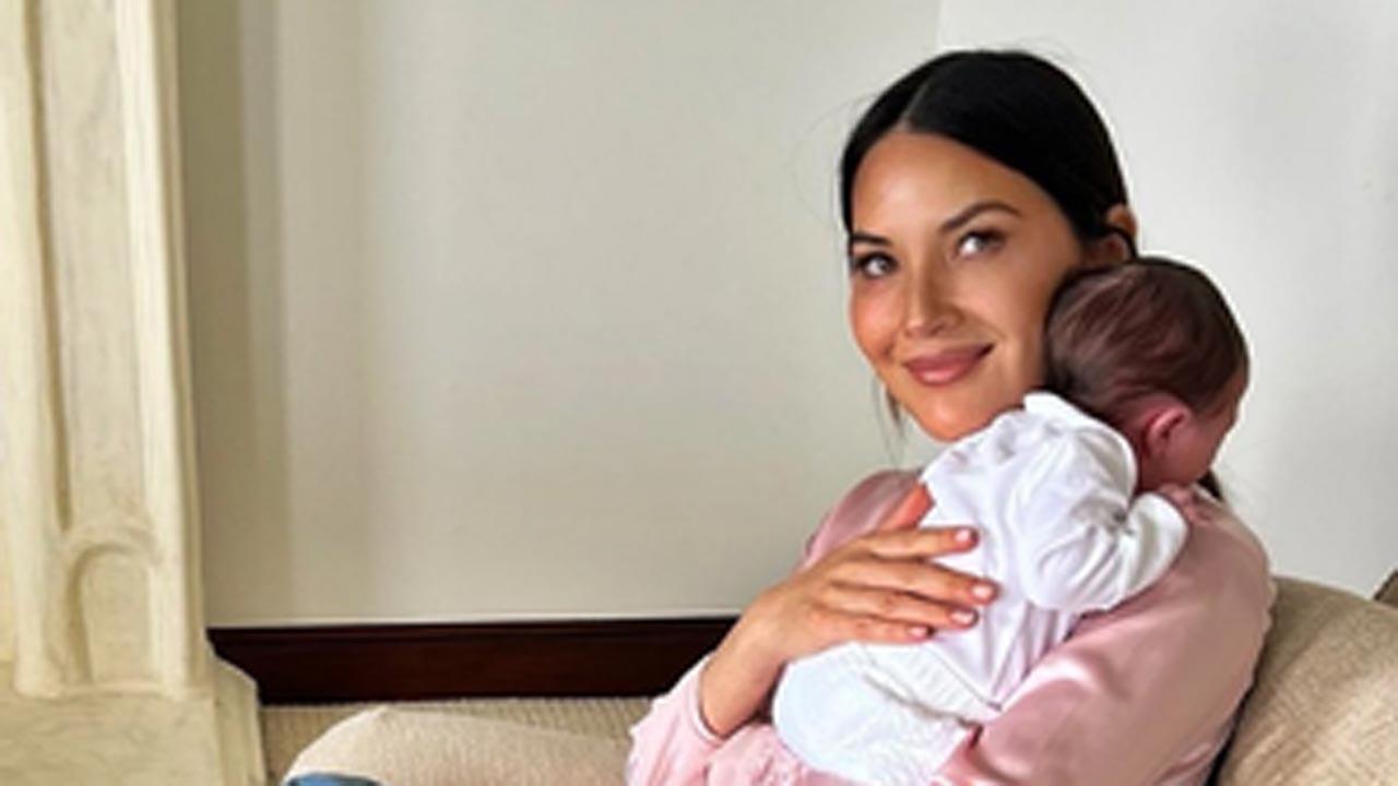 Olivia Munn shares photo of herself with newborn in support of breast cancer awa