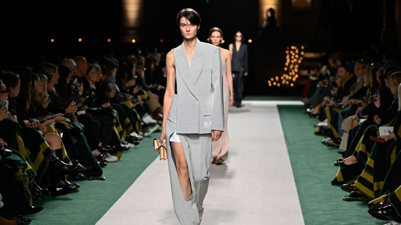 Model showcases a creation by Victoria Beckham
Victoria Beckham's suits were cut closer to the body and were a lot less literal, some with sleeves torn of or legs slashed -- if these symbols of male power had been mauled by all the ages of stored-up female rage.  