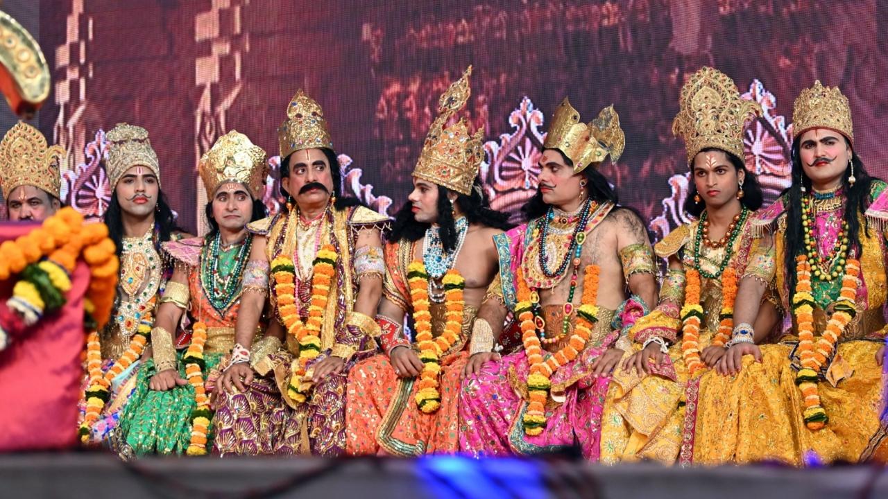 The theater artistes are seen donning colorful costumes and perfecting their dramatic expressions