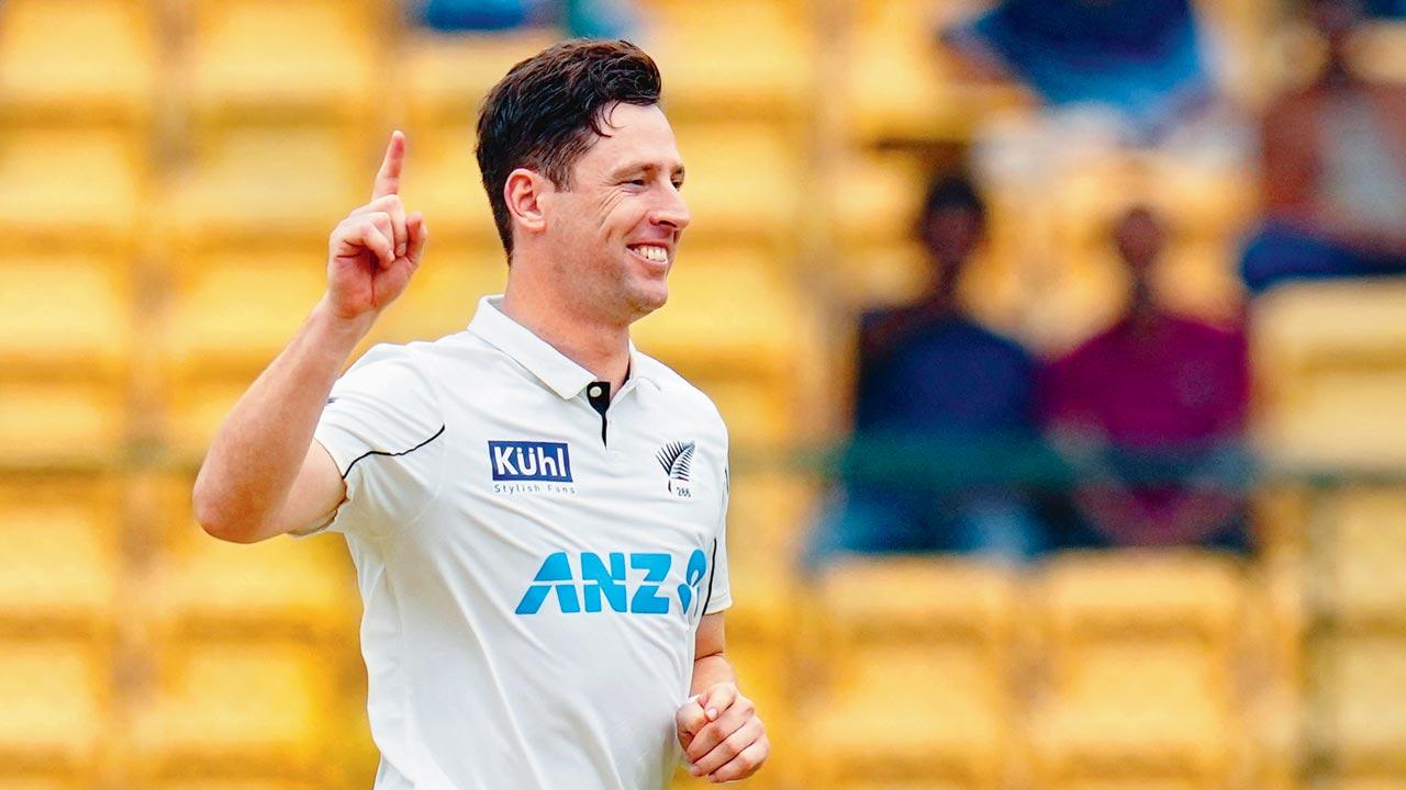 NZ pacer Matt Henry celebrates an Indian wicket during his 5-15 yesterday. Pics/PTI
