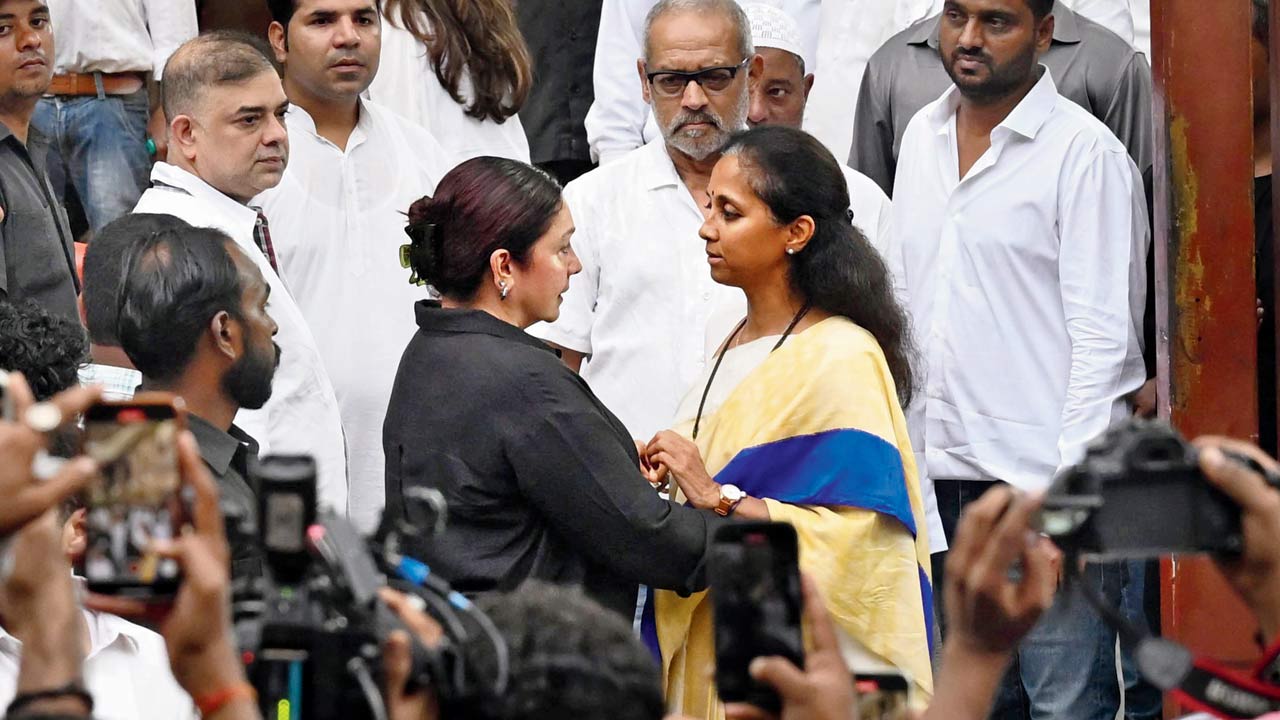 NCP-SP MP Supriya Sule offers her condolences to actor and director Pooja Bhatt, a close friend of Baba Siddique. Pic/Anurag Ahire