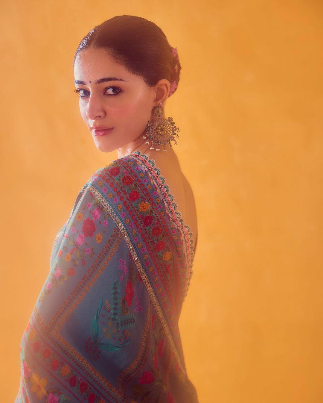 To complete her look, Panday tied her hair back into a chic bun. She skipped heavy jewelry and opted for a pair of intricate earrings instead.