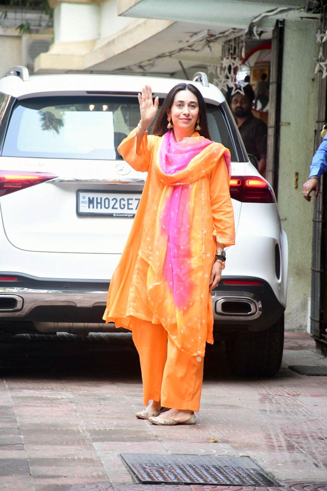 Karisma Kapoor radiated happiness in a bright salwar suit on the festive occasion. 
