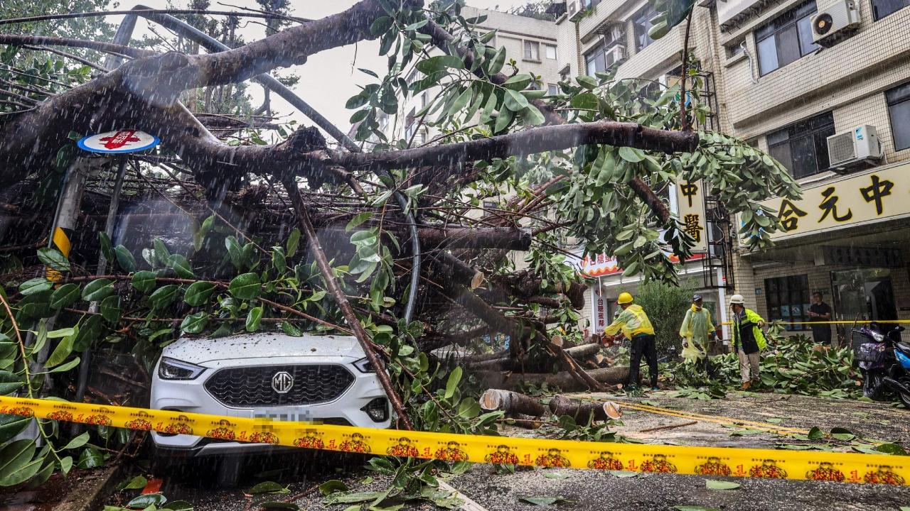 IN PHOTOS: Schools closed, flights affected as typhoon reaches coast in Taiwan