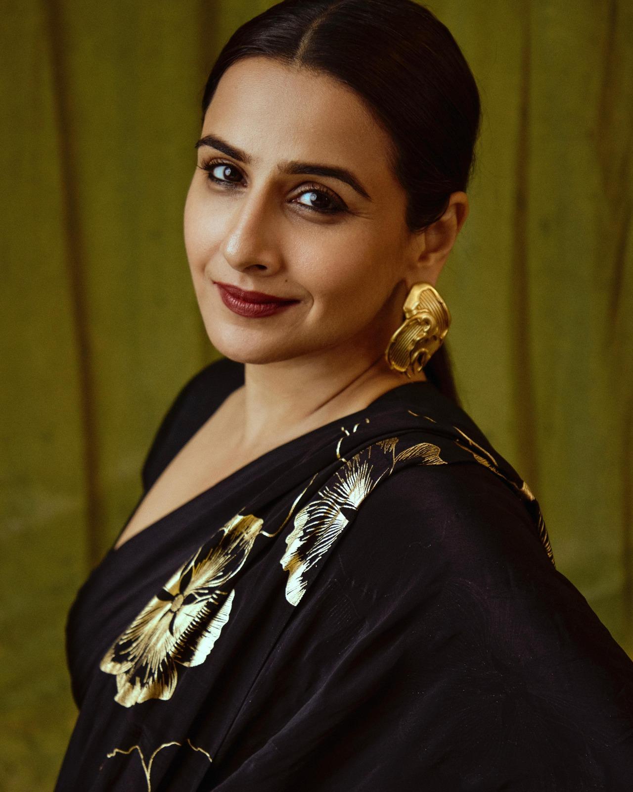 For the Ahmedabad Press Show of the film, Vidya looked stunning in a gold foil-printed saree from the sustainable fashion brand shop369. This saree, a tribute to eco-friendly luxury and timeless elegance, featured a beautiful golden flower print. Vidya’s choice highlighted her commitment to conscious fashion, making a powerful statement