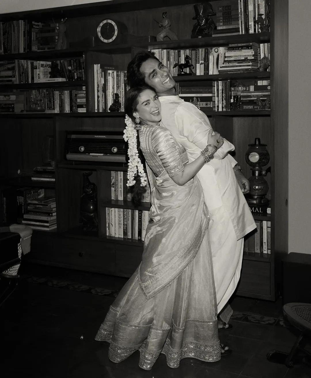 In this cute yet candid picture, Aditi can be seen trying to lift her dear husband Siddharth, and it’s so wholesome.