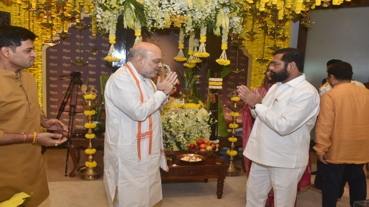 Maharashtra CM Eknath Shinde greets Amit Shah at his official residence Varsha