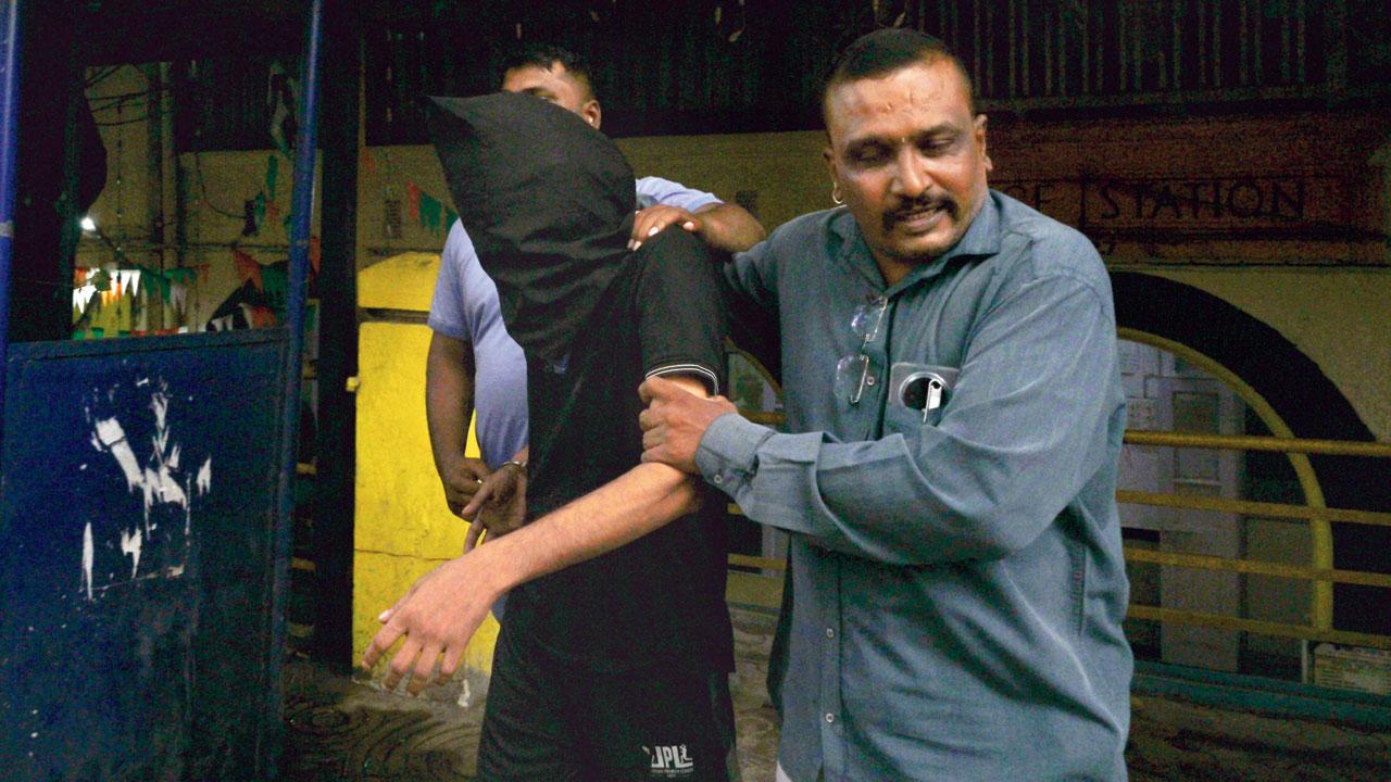 Datta Murlidhar Shinde, the accused, being taken to court