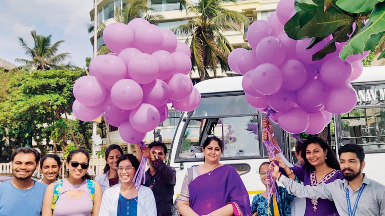 Members and volunteers release purple balloons at Marine Drive