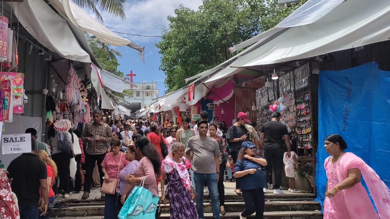 They not only spend time sitting in the church and praying but also take their time walking through the Bandra Fair that starts from Mount Mary Steps.
