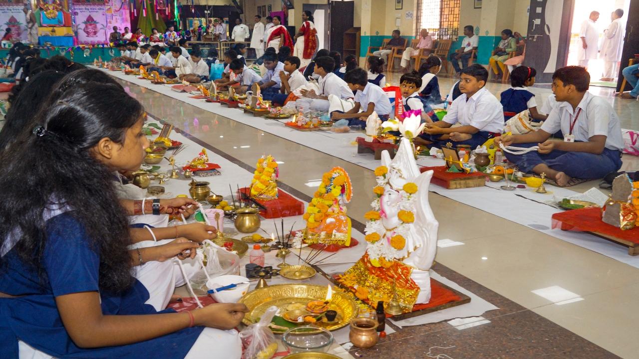 Students at Saraswati Sishu Bidya Mandir, Bhubaneswar, perform Ganesh Chartuthi rituals  